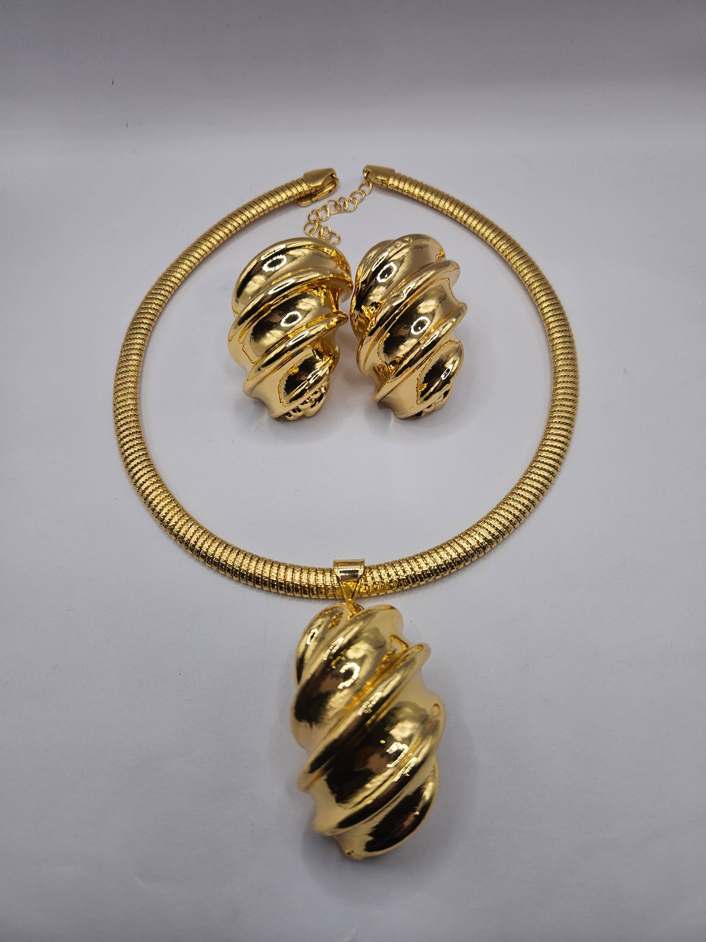 Gold-Plated Swirl Statement Necklace & Earrings Set – Modern Sculptural Design